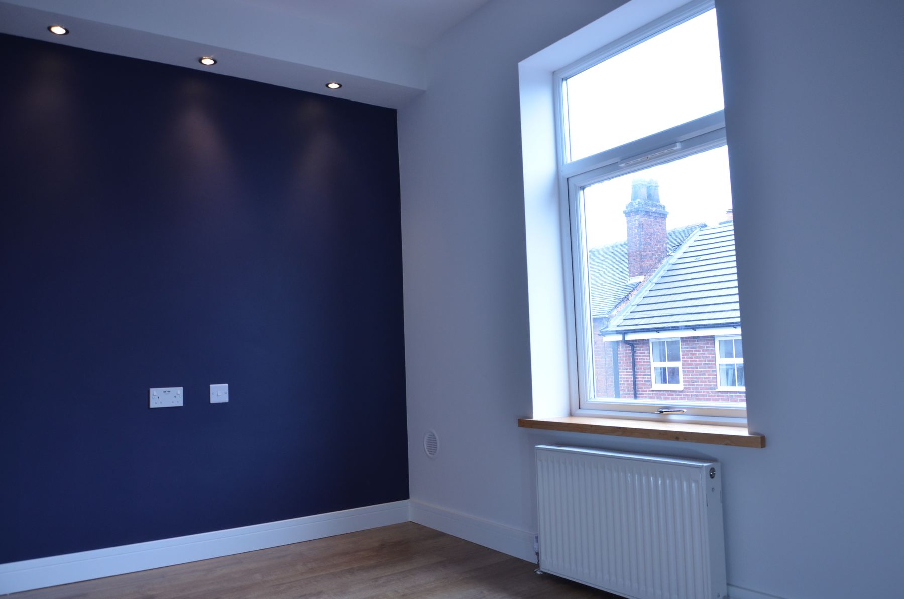 Room window and radiator after refurbishment